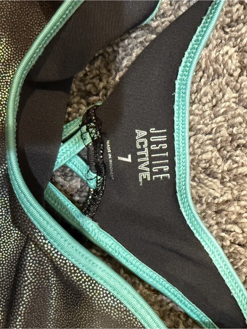 Justice Black One-Piece Gymnastics Leotard with Silver Shimmer and Teal Trim